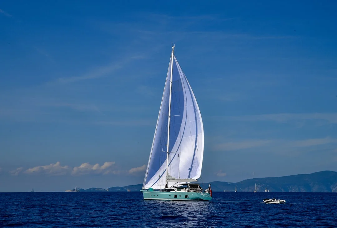 Sailboat gliding across the deep blue Aegean Sea