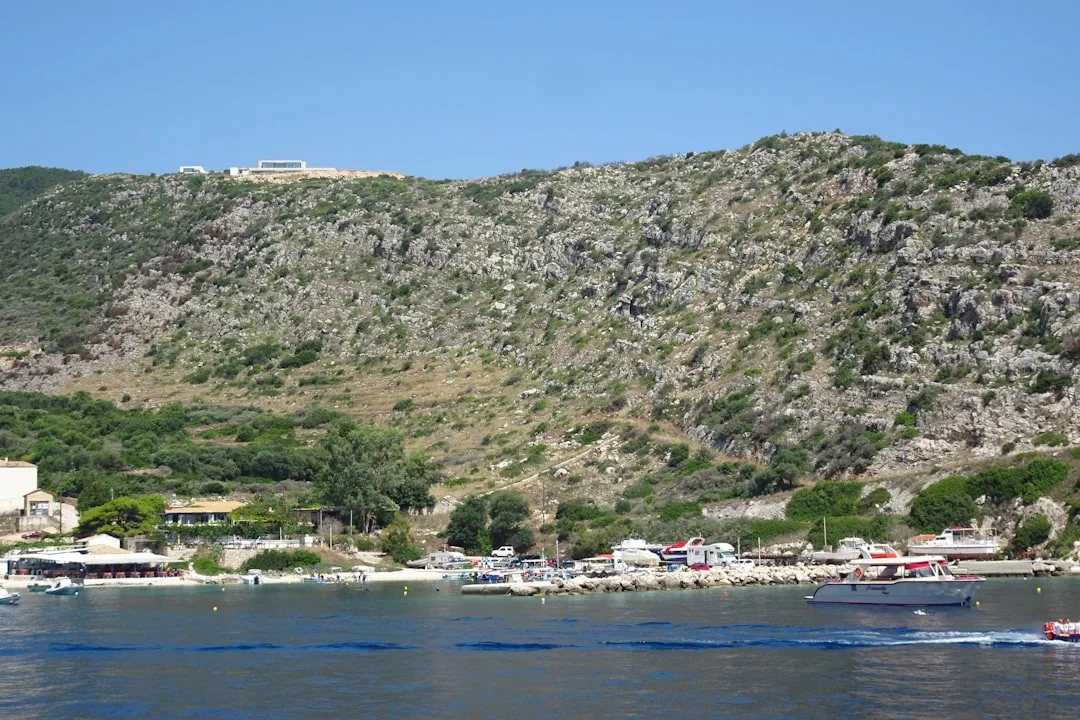 Croatian harbor with colorful boats and old stone buildings
