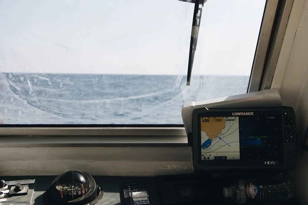 Marine GPS chart plotter mounted on a sailboat cockpit console