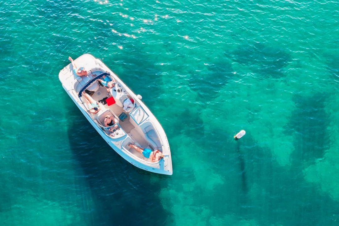 Crew on deck of sailboat preparing to anchor