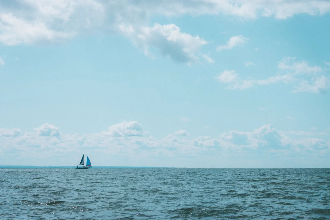 Lone sailboat on open ocean waters during an offshore passage