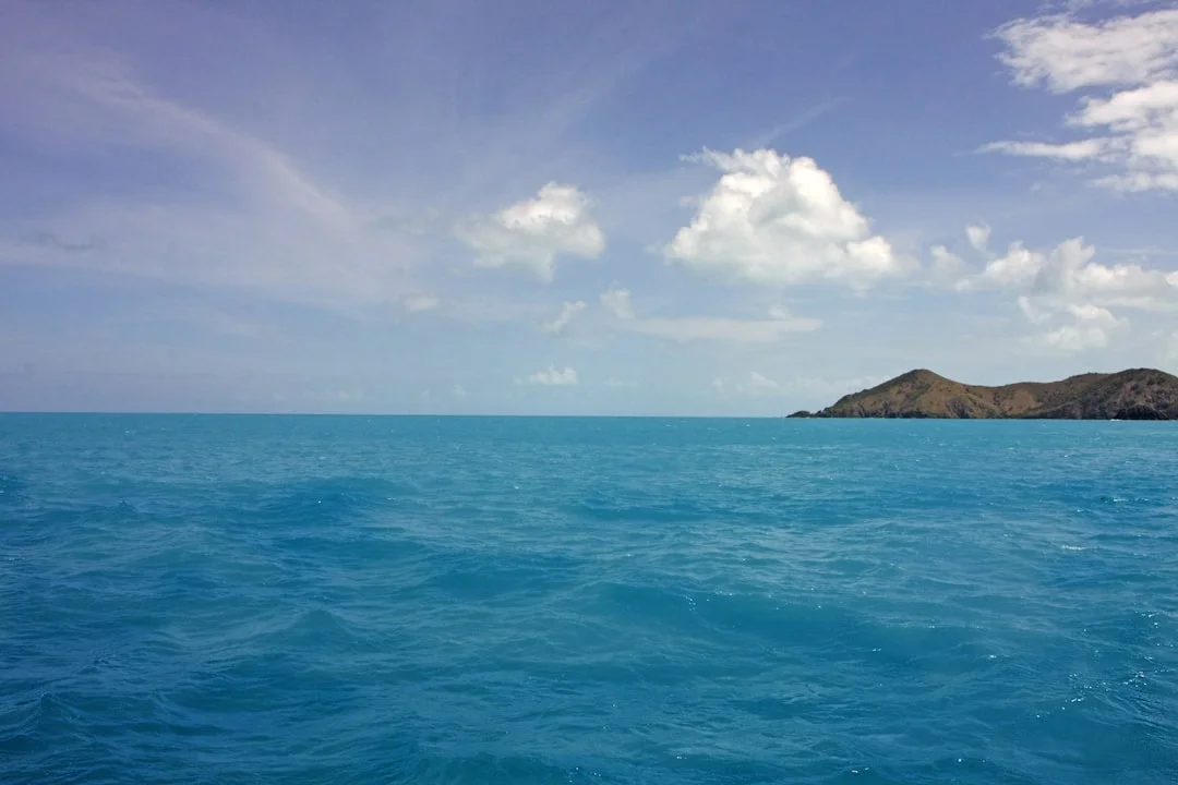 Crystal-clear Caribbean water with small tropical island