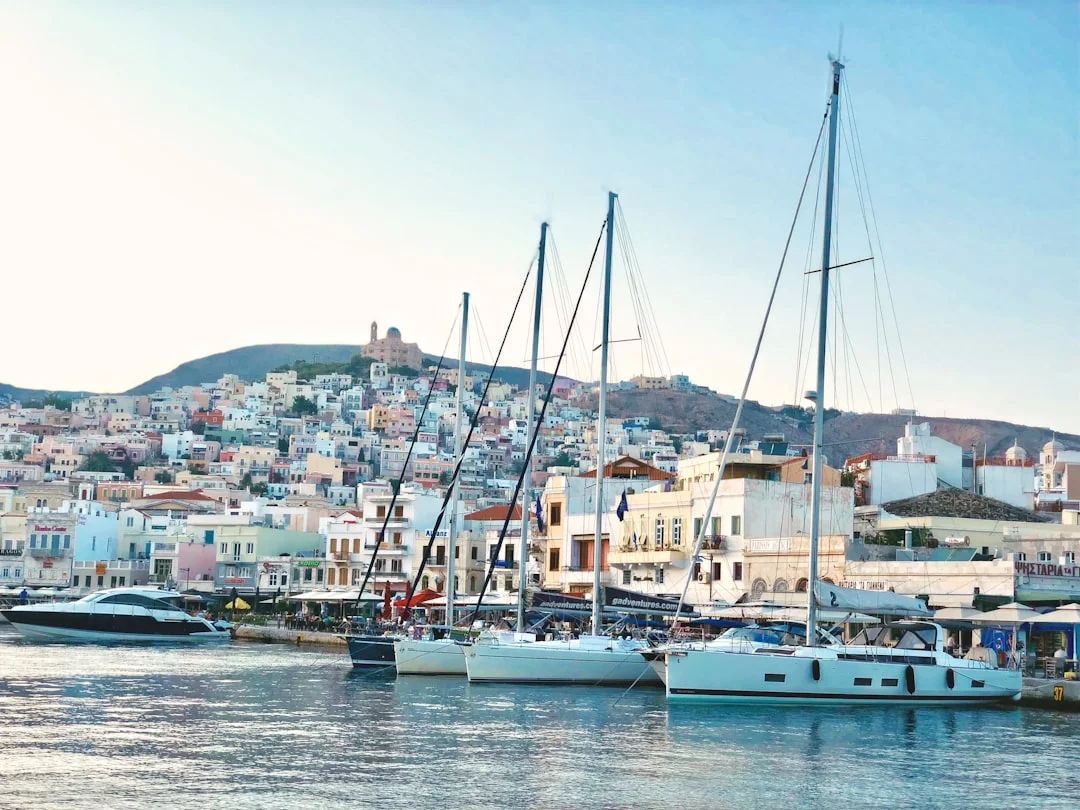 Panoramic view of a Cyclades island town with whitewashed buildings and blue sea