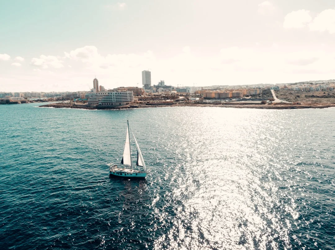 Sailboat under full sail on the blue Mediterranean Sea in Europe