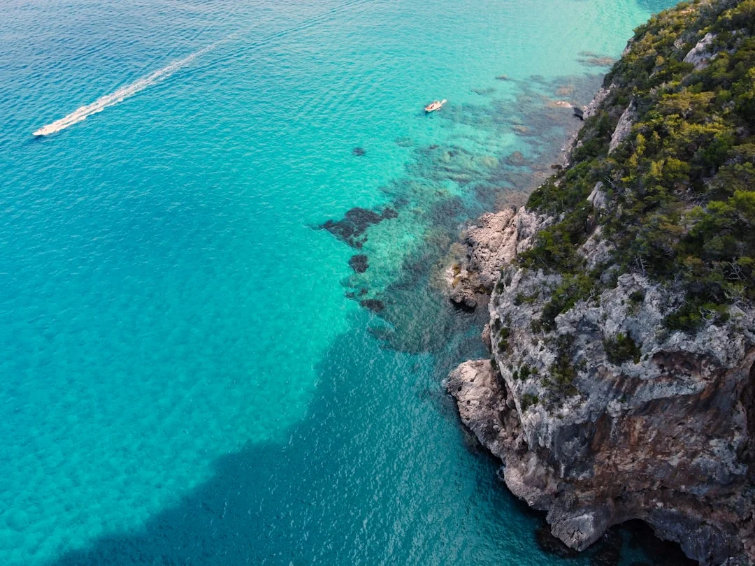 Sailboat cruising along the Sardinian coast