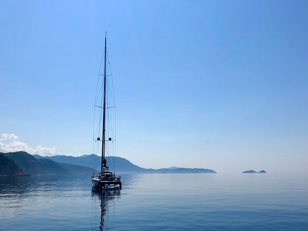 Dubrovnik old town from the sea with sailing yacht
