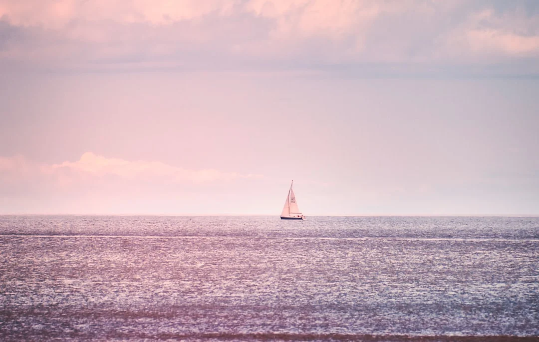 Sailboat alone in the middle of the Atlantic Ocean