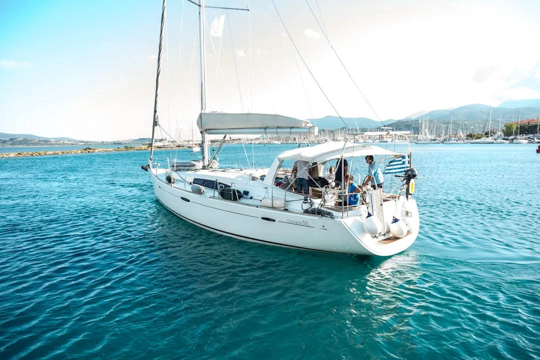 Crew sailing together on a charter yacht in open water