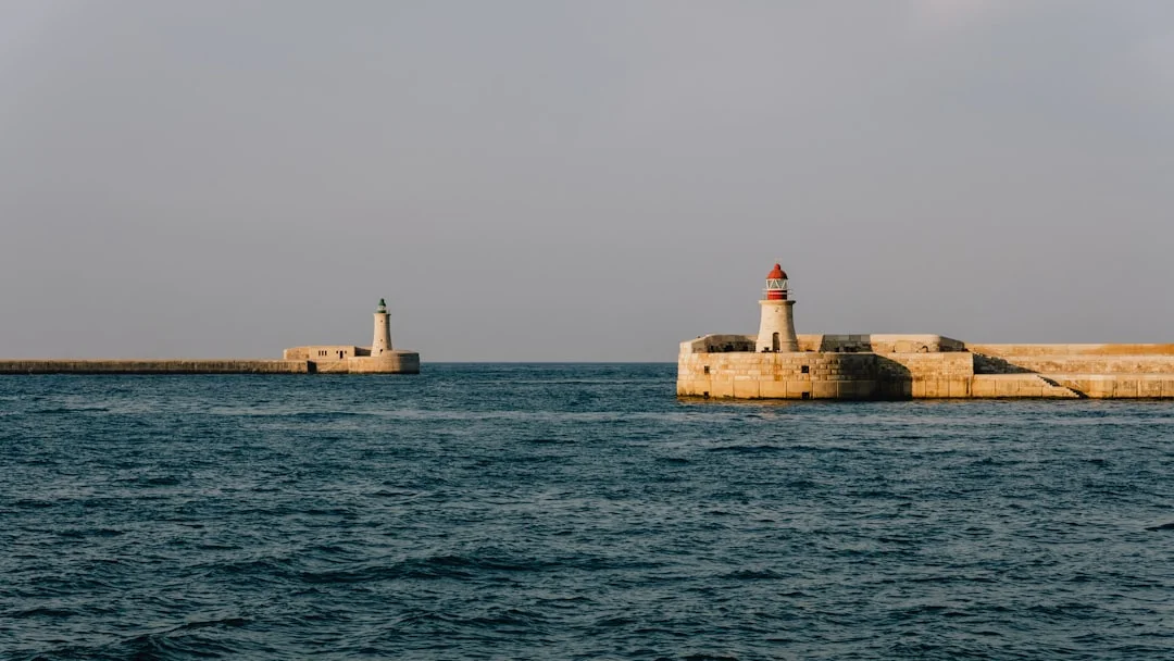Lighthouse and breakwater at Valletta Grand Harbour
