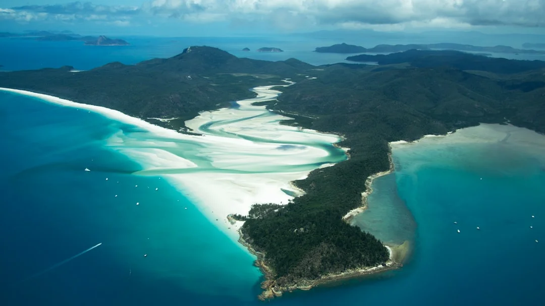 Aerial view of Whitehaven Beach silica sand swirls Whitsundays