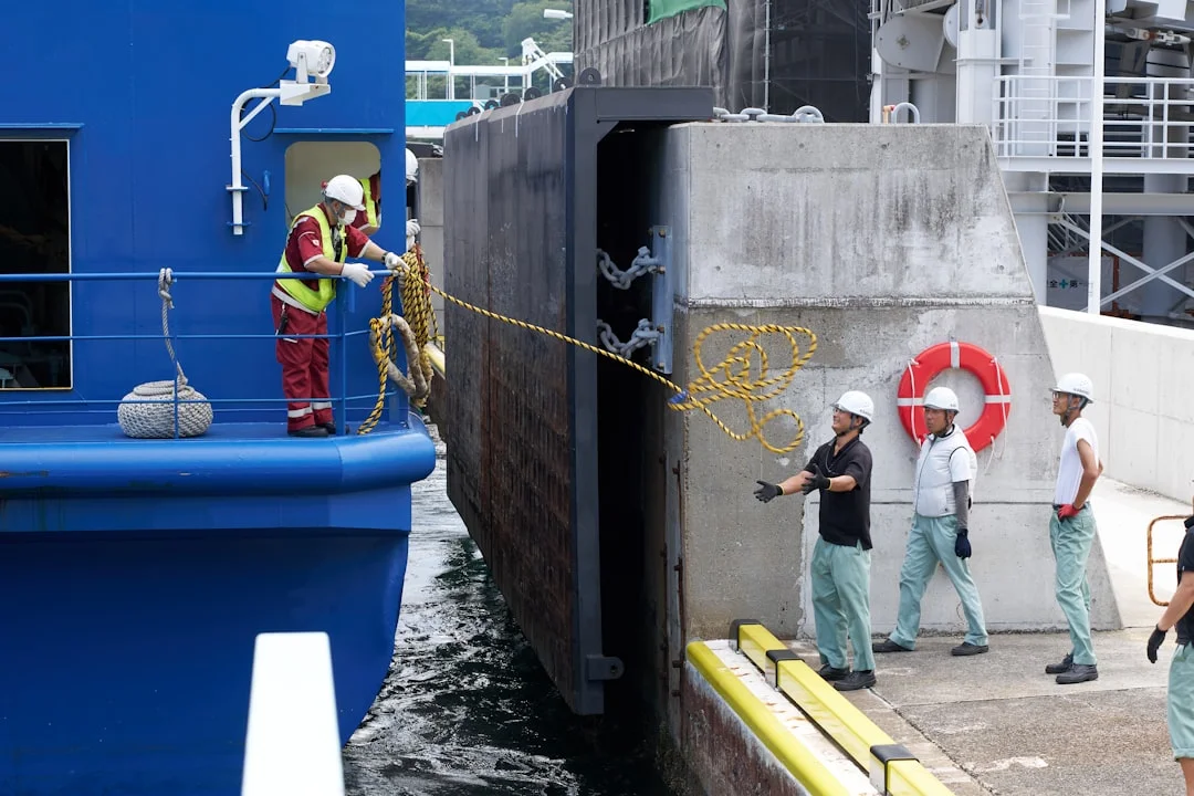 charter base dock scene with crew doing handover inspection and taking photos