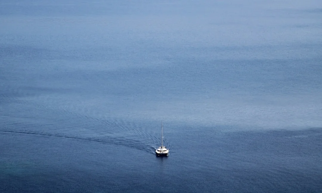 Catamaran sailing through the blue waters of the Aegean Sea
