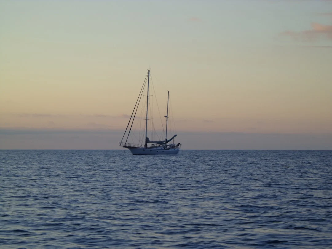 Sailboat crossing the open Pacific Ocean under sail