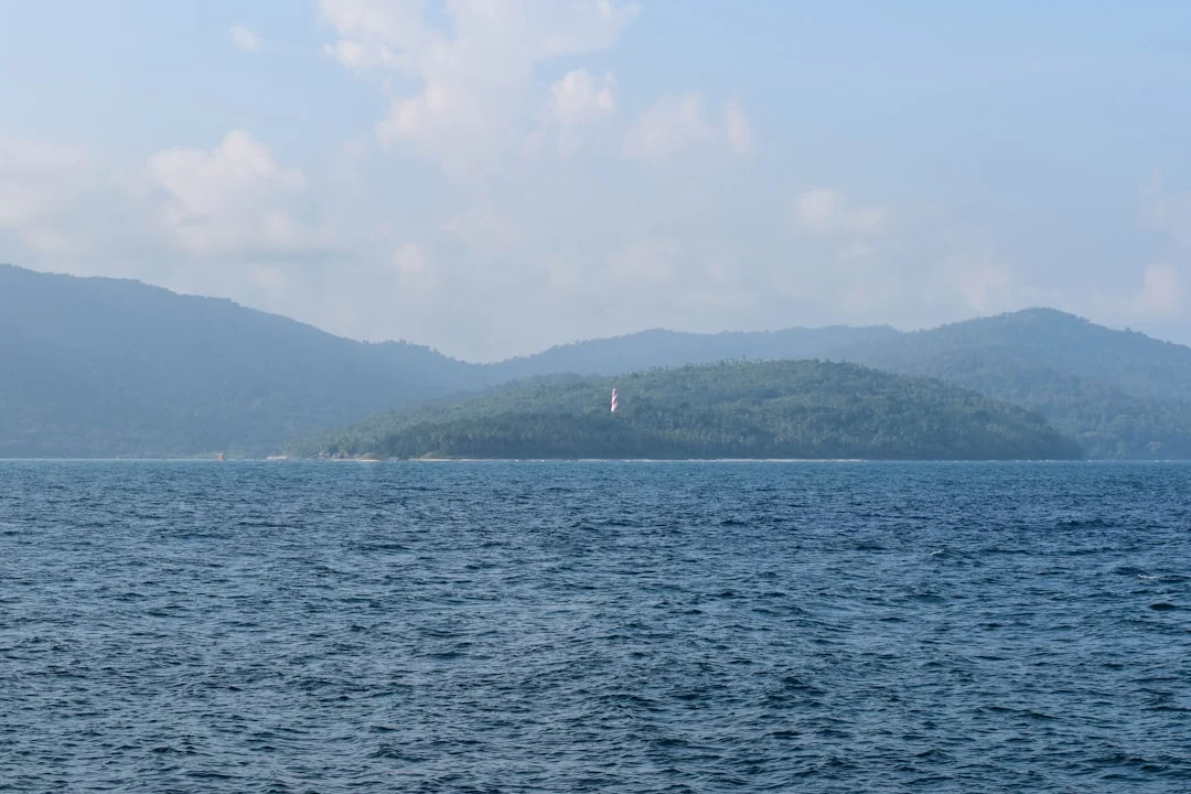 Calm bay in the Andaman Islands with forested headlands