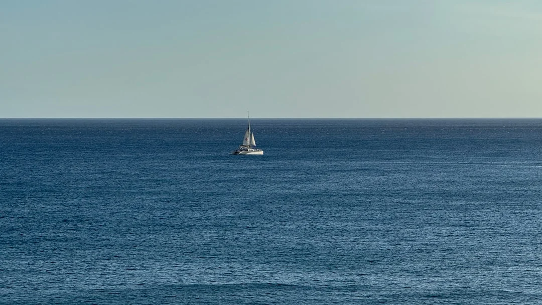 Sailboat under full sail in the middle of the Pacific Ocean