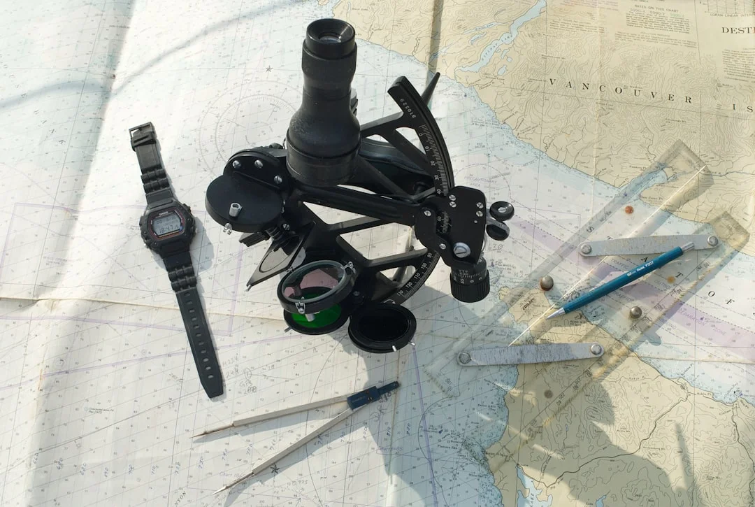 Marine sextant with watch dividers and ruler on a paper nautical chart