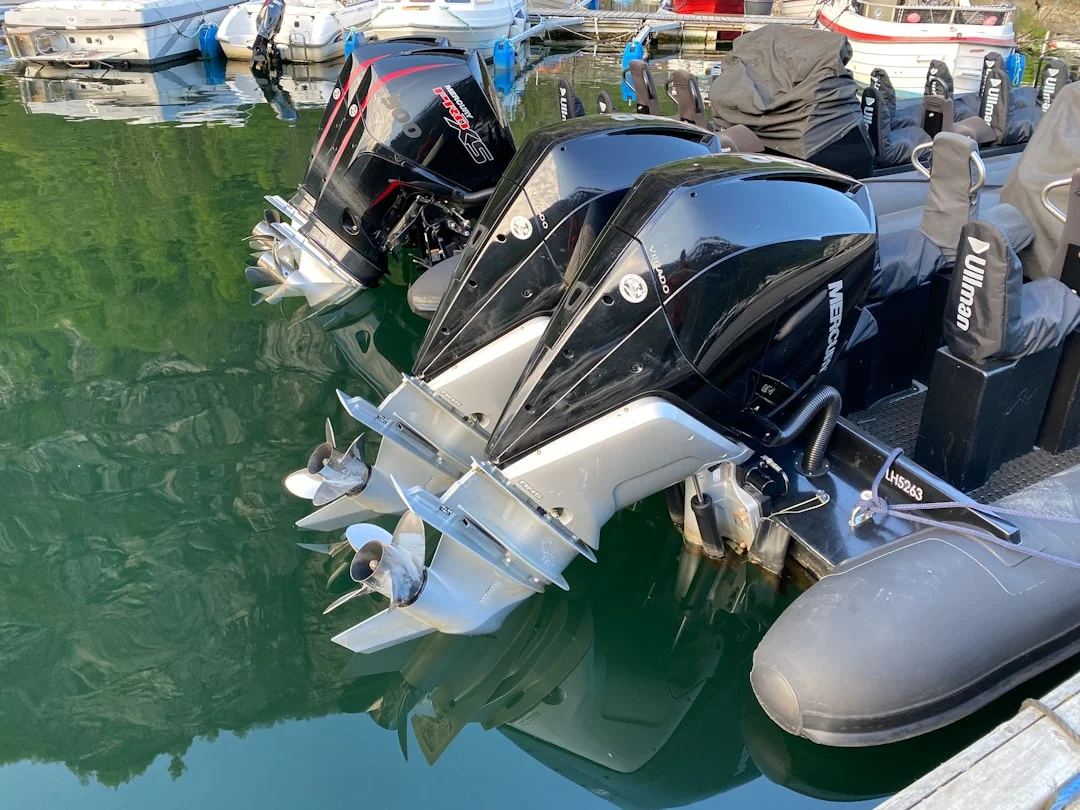 A 6–10 hp outboard on a rail mount with salt spray, highlighting common corrosion points and tilt mechanism