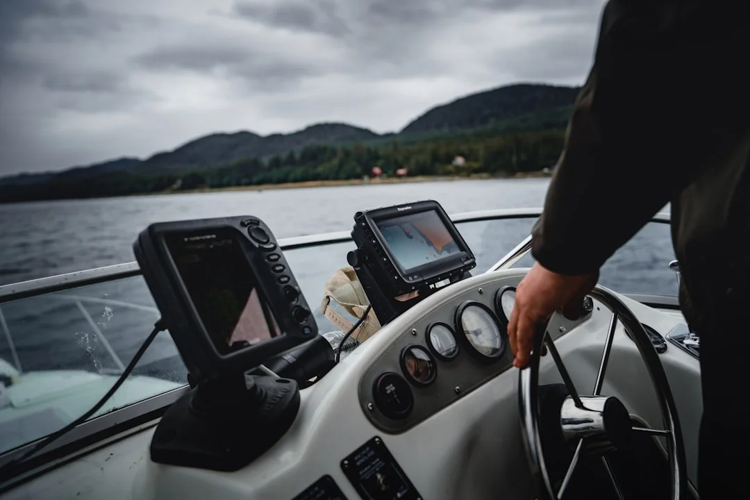 Vessel at anchor near shoal area with VHF mic in foreground
