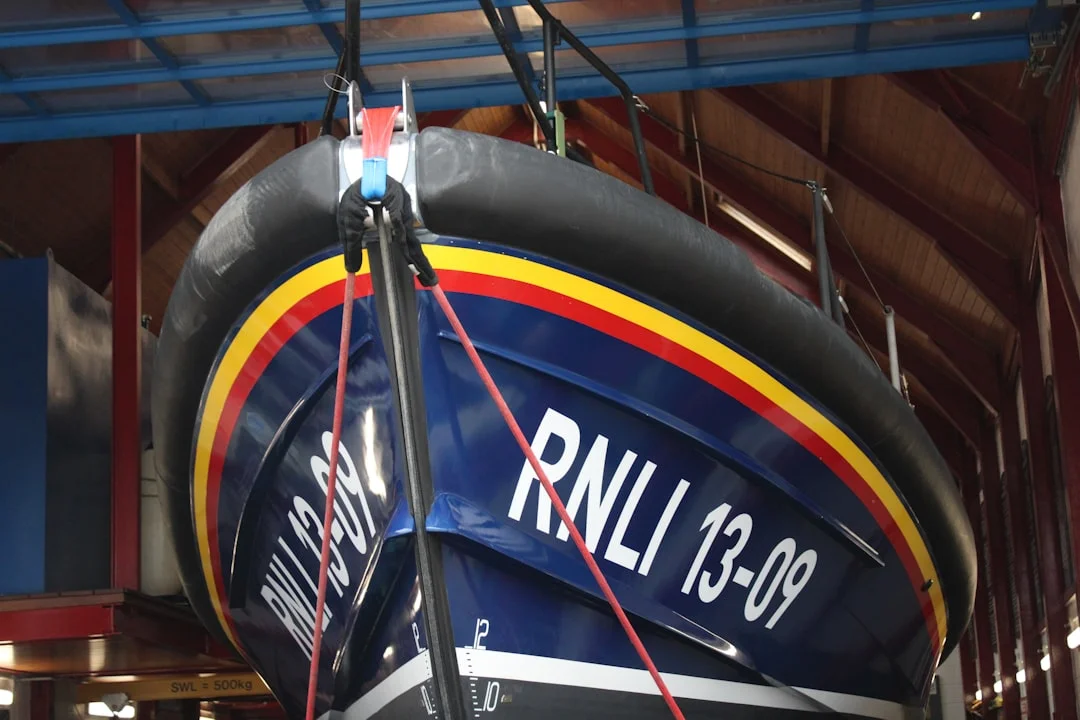 Sailboat mast and rigging against a blue sky at spring commissioning