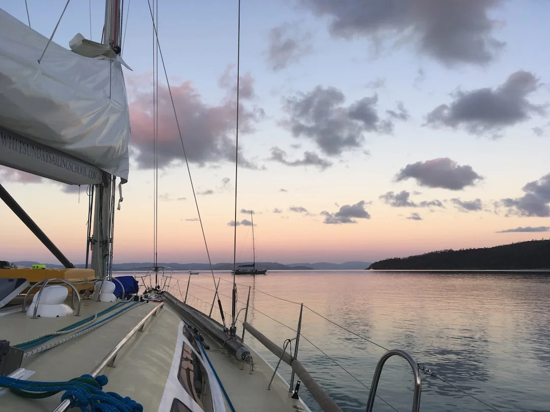 Sailboats anchored in turquoise water of the Whitsunday Islands