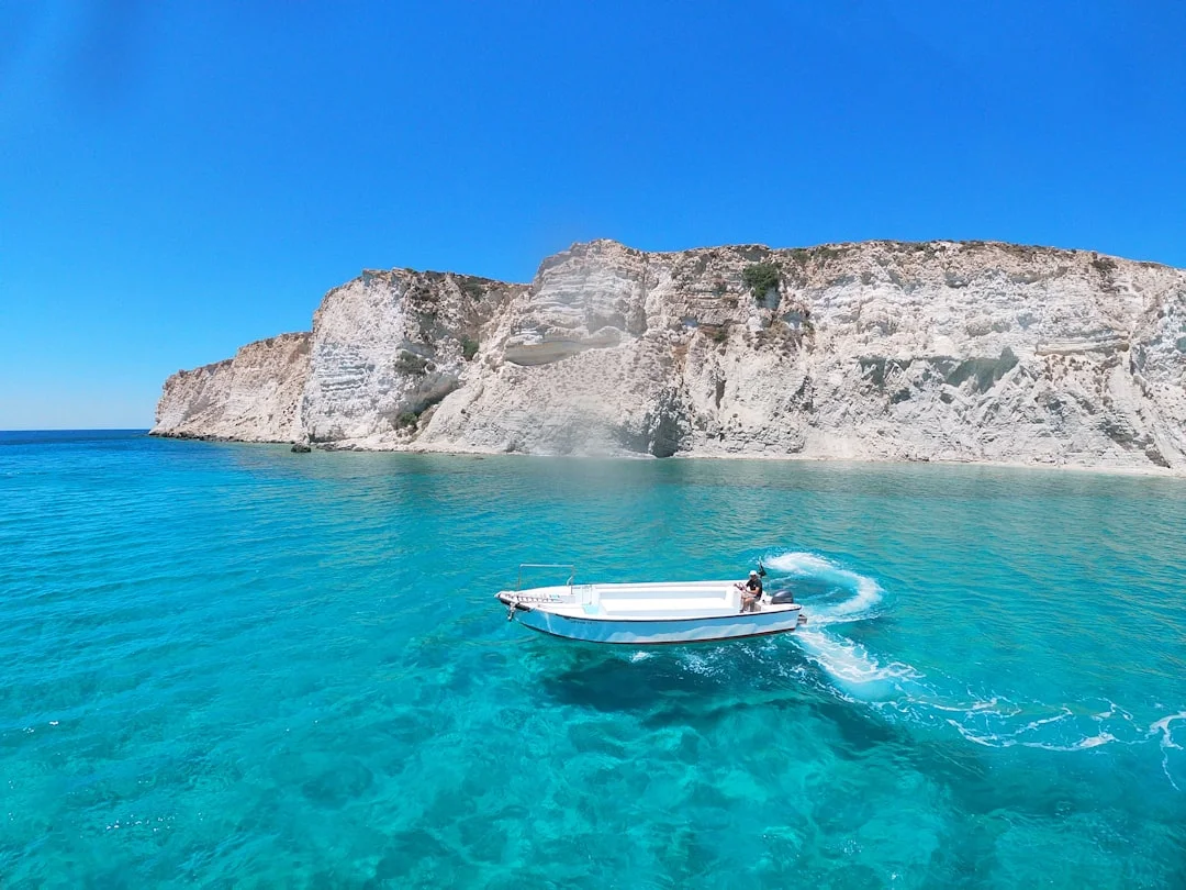 Sailboat turning on the open Aegean Sea near the Greek islands