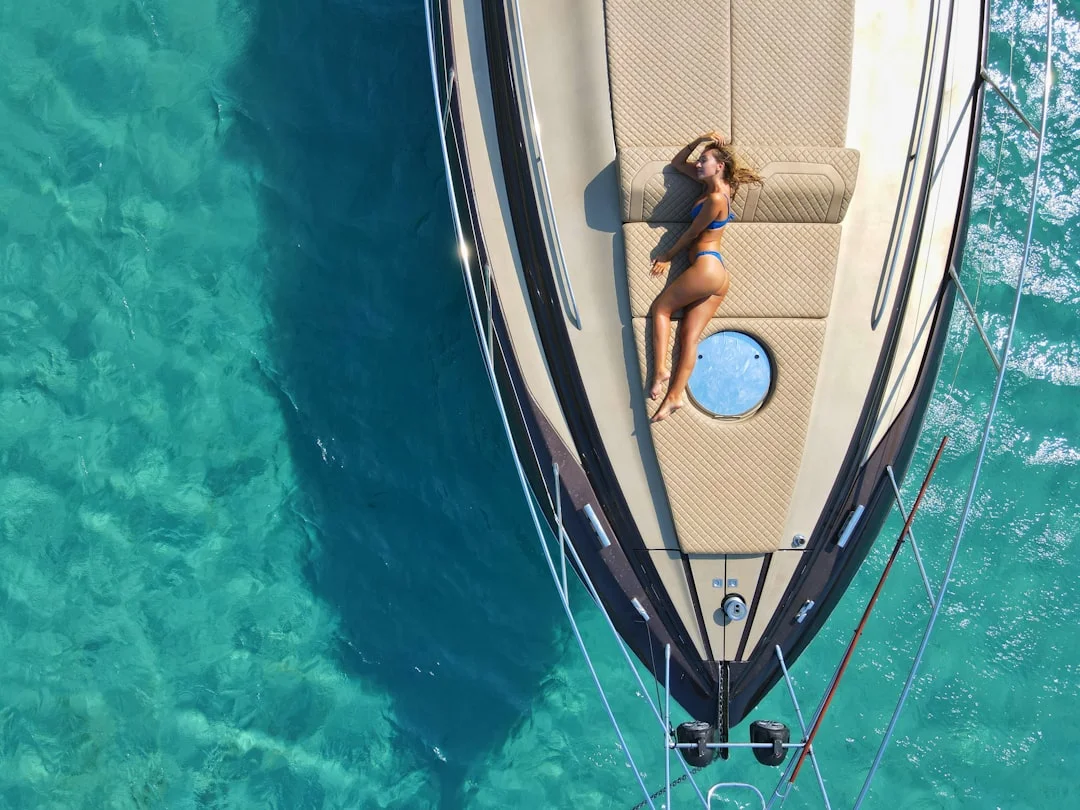 Aerial drone view of the Santorini caldera with deep blue water and volcanic cliffs