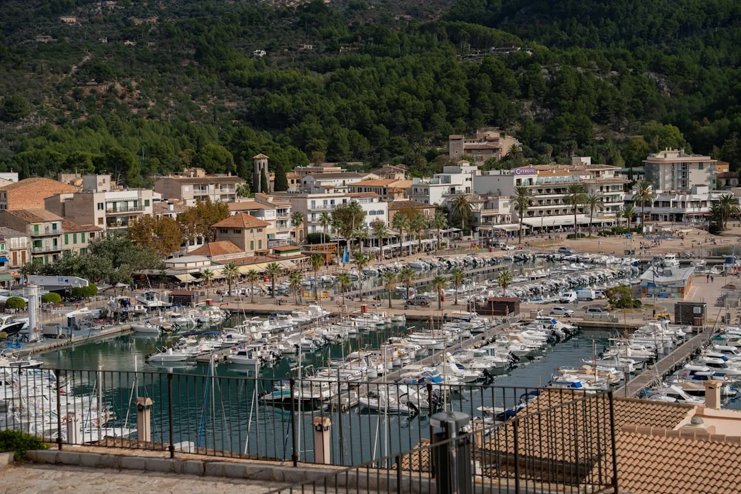 Balearic marina packed with yachts and superyacht quay in background