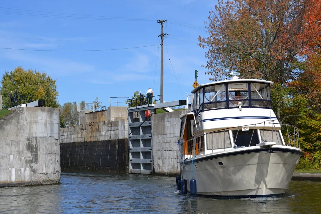 Close-up of lock filling ports and turbulent water alongside a concrete wall