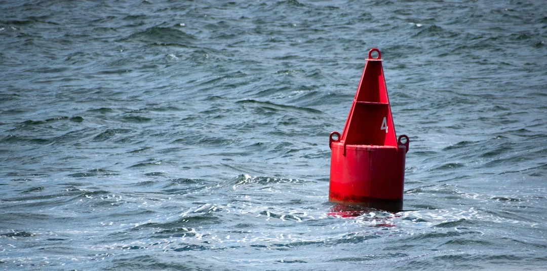 Diagram-style photo showing approach into wind, buoy off the bow, crew staged with strop