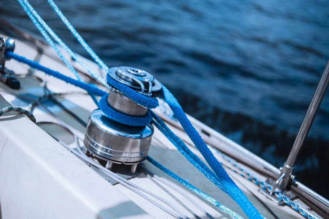 winch grease and pawl oil next to snap-ring pliers and nylon brush