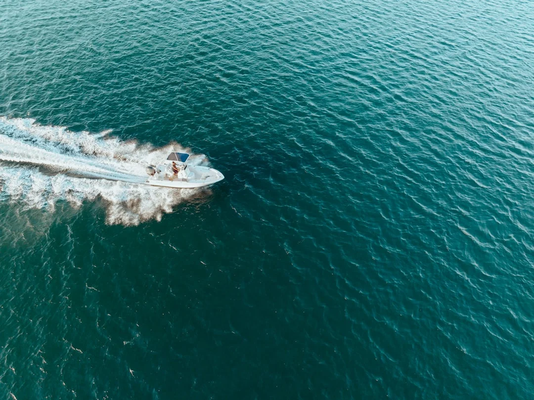 Diagram-style image showing gasoline vapors sinking into bilge vs diesel spill slick on water