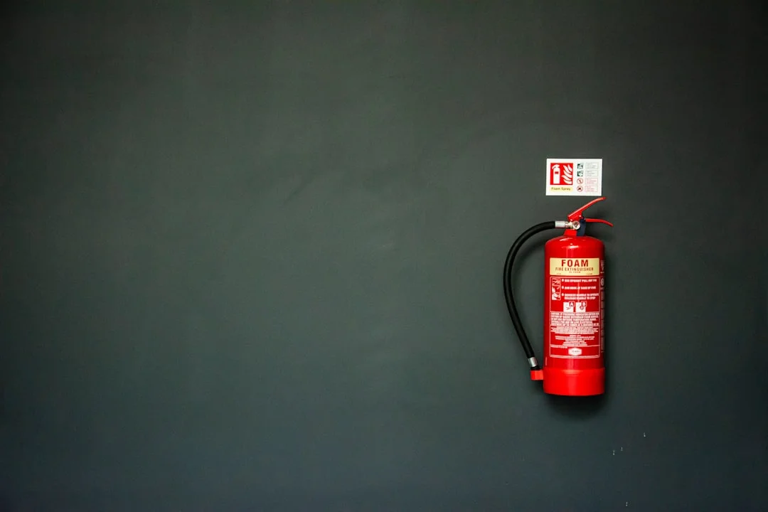 USCG-approved fire extinguisher label showing UL rating and marine mounting bracket